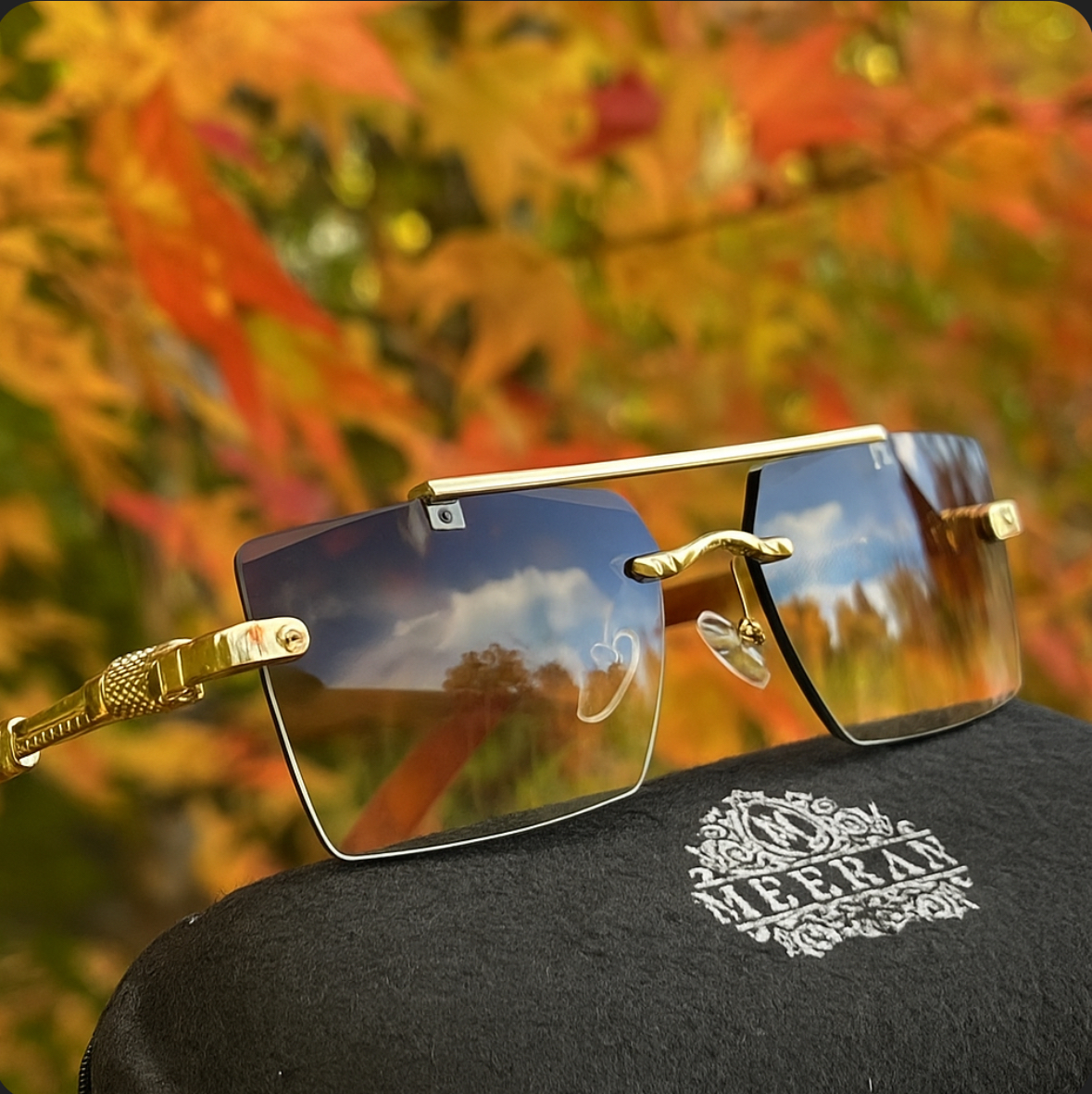  Meeran Jaguar sunglasses with golden gradient lenses and a golden rim, featuring UV protection.